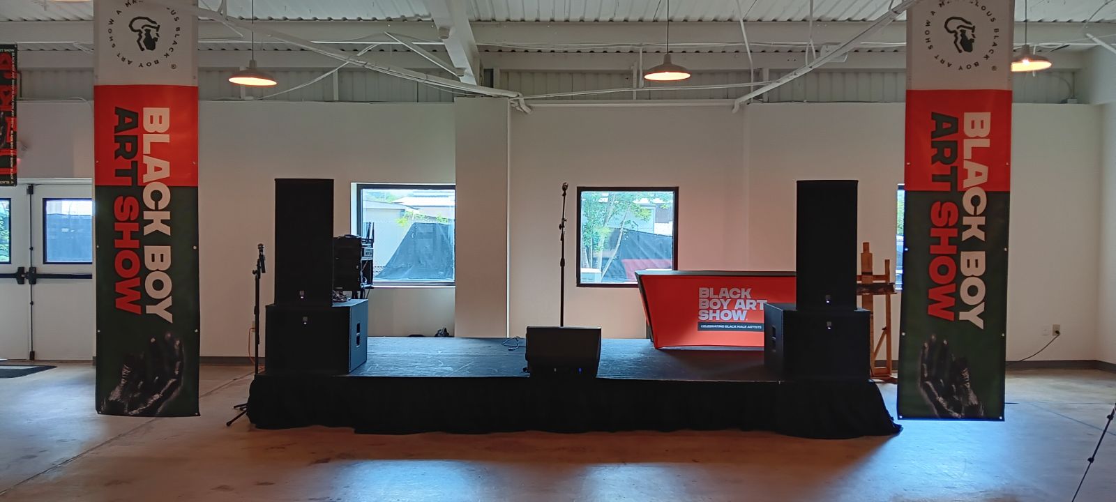 Indoor Black Boy Art Show stage audio setup