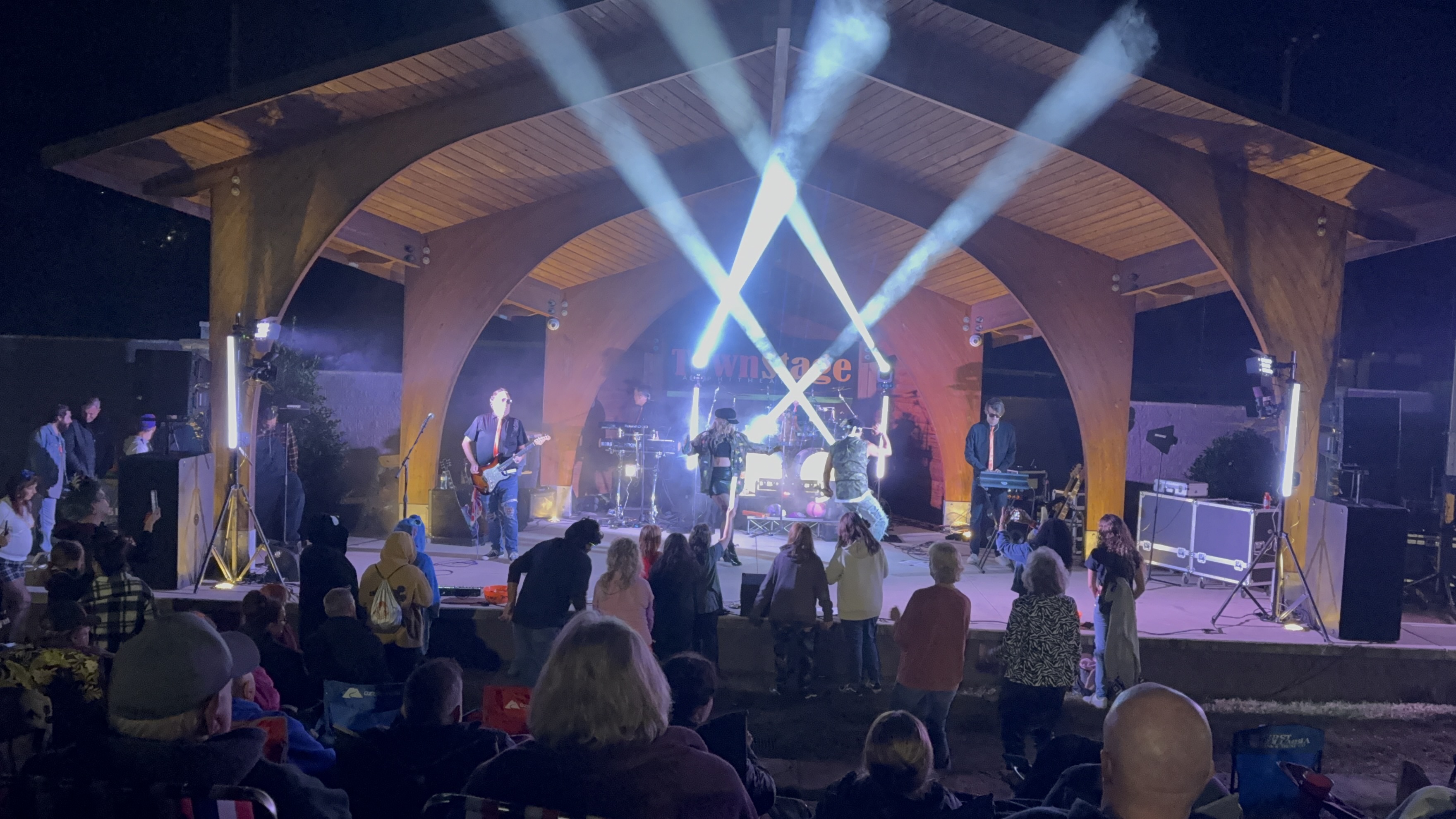 Live concert production with stage lighting and audience